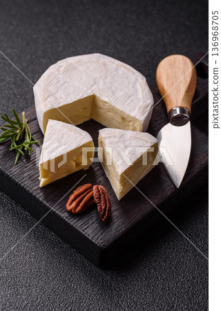 White French cream cheese Brie or Camembert for breakfast. Brie or Camembert cheese 136968705