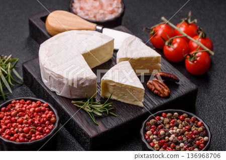 White French cream cheese Brie or Camembert for breakfast. Brie or Camembert cheese 136968706