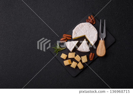 White French cream cheese Brie or Camembert for breakfast. Brie or Camembert cheese 136968715