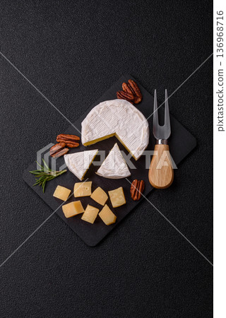 White French cream cheese Brie or Camembert for breakfast. Brie or Camembert cheese 136968716