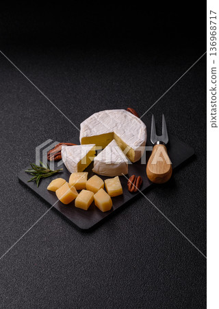 White French cream cheese Brie or Camembert for breakfast. Brie or Camembert cheese 136968717