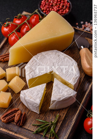 White French cream cheese Brie or Camembert for breakfast. Brie or Camembert cheese 136968737