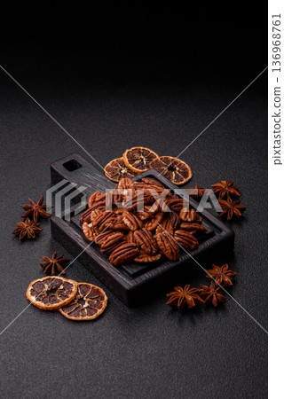 Peeled and roasted pecan nut as an ingredient for healthy food. Pecan nut as a food background Peeled and roasted pecan nut as an ingredient for healthy food. Pecan nut as a food background 136968761