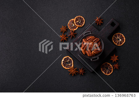 Peeled and roasted pecan nut as an ingredient for healthy food. Pecan nut as a food background 136968763