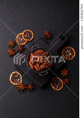 Peeled and roasted pecan nut as an ingredient for healthy food. Pecan nut as a food background Peeled and roasted pecan nut as an ingredient for healthy food. Pecan nut as a food background 136968764