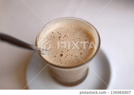 Hot Coffee Cup on Table with Natural Light Hot Coffee Cup on Table with Natural Light 136968807