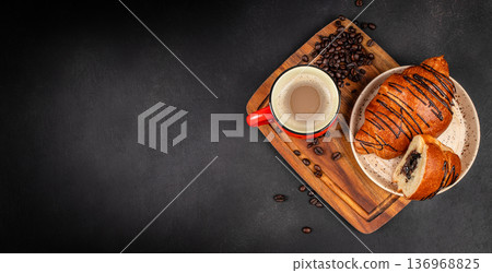 Chocolate Croissants with Coffee on Dark Background and Copy Space Chocolate Croissants with Coffee on Dark Background and Copy Space 136968825
