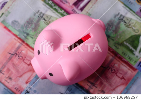 A piggy bank as a concept for storing, accumulating, and saving financial resources. A piggy bank A piggy bank as a concept for storing, accumulating, and saving financial resources. A piggy bank 136969257