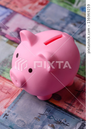 A piggy bank as a concept for storing, accumulating, and saving financial resources. A piggy bank 136969259