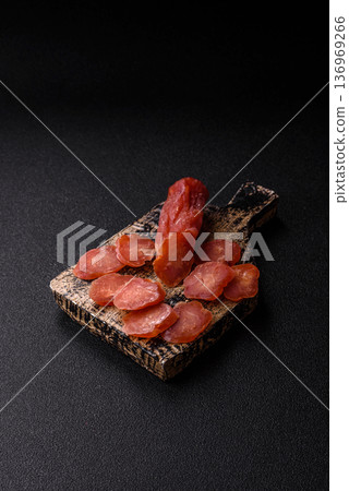 Sliced smoked dry sausage made from turkey or pork for sandwiches. Sliced smoked sausage 136969266