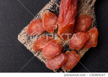 Sliced smoked dry sausage made from turkey or pork for sandwiches. Sliced smoked sausage 136969267