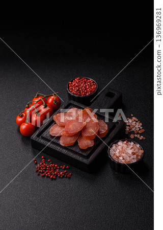 Sliced smoked dry sausage made from turkey or pork for sandwiches. Sliced smoked sausage Sliced smoked dry sausage made from turkey or pork for sandwiches. Sliced smoked sausage 136969281