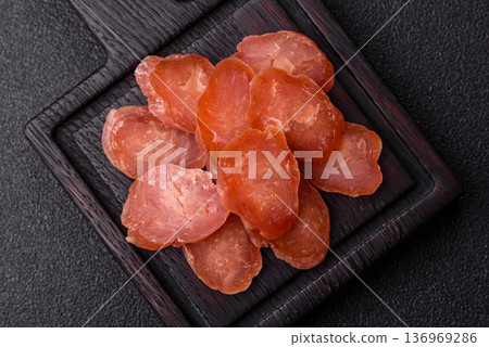 Sliced smoked dry sausage made from turkey or pork for sandwiches. Sliced smoked sausage 136969286
