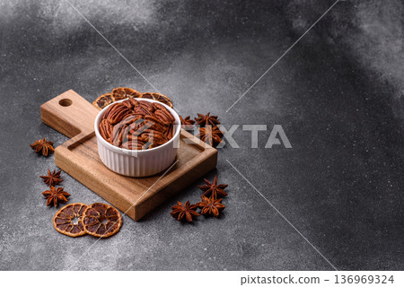 Peeled and roasted pecan nut as an ingredient for healthy food. Pecan nut as a food background Peeled and roasted pecan nut as an ingredient for healthy food. Pecan nut as a food background 136969324