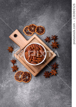 Peeled and roasted pecan nut as an ingredient for healthy food. Pecan nut as a food background Peeled and roasted pecan nut as an ingredient for healthy food. Pecan nut as a food background 136969326