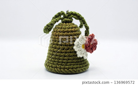 Crocheted Bell Ornament with Green Yarn and Decorative Flower on White Background Crocheted Bell Ornament with Green Yarn and Decorative Flower on White Background 136969572