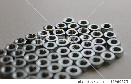 Pattern of nuts lie on a white surface tightly fitted to each other Pattern of nuts lie on a white surface tightly fitted to each other 136969575