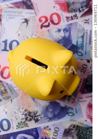 A piggy bank as a concept for storing, accumulating, and saving financial resources. A piggy bank A piggy bank as a concept for storing, accumulating, and saving financial resources. A piggy bank 136969711