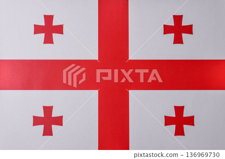 Georgia, the Georgian red and white flag as a symbol of independence and freedom. The Georgian flag Georgia, the Georgian red and white flag as a symbol of independence and freedom. The Georgian flag 136969730
