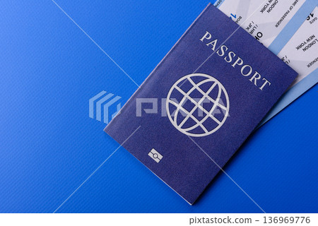 A passport with a foreign visa for flights, travel, and vacations abroad. An international passport A passport with a foreign visa for flights, travel, and vacations abroad. An international passport 136969776