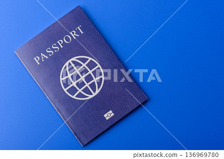 A passport with a foreign visa for flights, travel, and vacations abroad. An international passport A passport with a foreign visa for flights, travel, and vacations abroad. An international passport 136969780