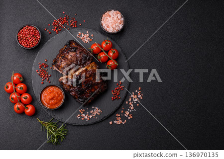 Grilled or barbecued pork or beef ribs, meat with red sauce for the dinner table. Grilled ribs 136970135