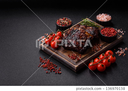 Grilled or barbecued pork or beef ribs, meat with red sauce for the dinner table. Grilled ribs 136970138