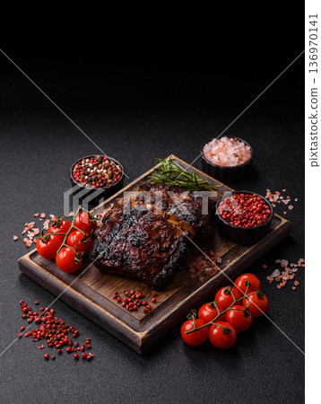 Grilled or barbecued pork or beef ribs, meat with red sauce for the dinner table. Grilled ribs Grilled or barbecued pork or beef ribs, meat with red sauce for the dinner table. Grilled ribs 136970141
