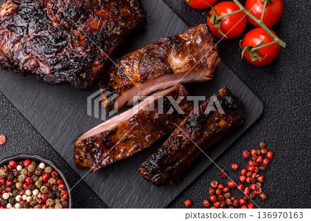 Grilled or barbecued pork or beef ribs, meat with red sauce for the dinner table. Grilled ribs Grilled or barbecued pork or beef ribs, meat with red sauce for the dinner table. Grilled ribs 136970163