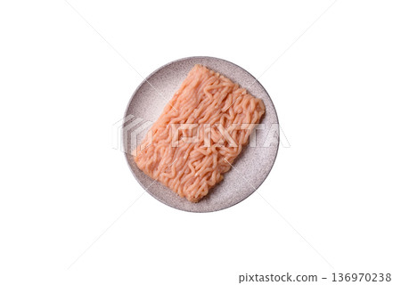 Raw ground chicken for burgers and other food. Raw minced chicken meat Raw ground chicken for burgers and other food. Raw minced chicken meat 136970238