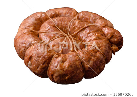 Grilled sausage in the shape of a spiral or snail, from chicken or pork. Spiral or snail sausage Grilled sausage in the shape of a spiral or snail, from chicken or pork. Spiral or snail sausage 136970263