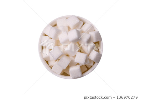 Sweet white sugar cubes as a source of glucose. White sugar cubes as a food background Sweet white sugar cubes as a source of glucose. White sugar cubes as a food background 136970279