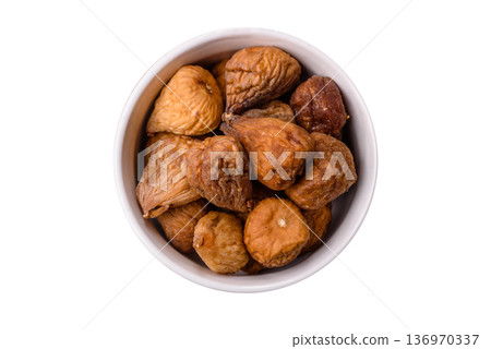 Dried fig are a sweet, healthy fruit for vegans and vegetarians. Dried fig as a food background Dried fig are a sweet, healthy fruit for vegans and vegetarians. Dried fig as a food background 136970337