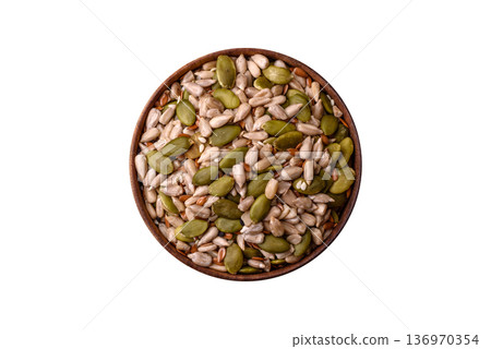 Shelled sunflower, sesame, pumpkin, and flaxseed kernels as ingredients for healthy food Shelled sunflower, sesame, pumpkin, and flaxseed kernels as ingredients for healthy food 136970354