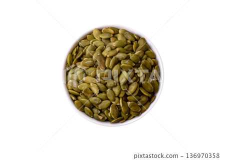 Shelled pumpkin seed kernels, salted, roasted, or raw, are a healthy ingredient. Pumpkin seeds Shelled pumpkin seed kernels, salted, roasted, or raw, are a healthy ingredient. Pumpkin seeds 136970358