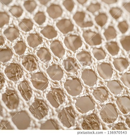 Close Up of Beige Knitted Net Texture Background with Woven Pattern 136970543