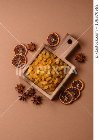 Sweet, dry, golden or yellow raisin made from grapes are a healthy, nutritious food. Golden raisins 136970965