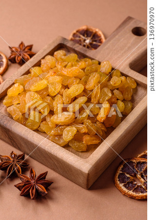 Sweet, dry, golden or yellow raisin made from grapes are a healthy, nutritious food. Golden raisins 136970970