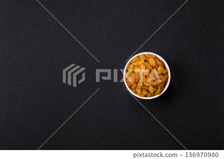 Sweet, dry, golden or yellow raisin made from grapes are a healthy, nutritious food. Golden raisins Sweet, dry, golden or yellow raisin made from grapes are a healthy, nutritious food. Golden raisins 136970980
