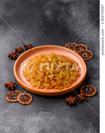 Sweet, dry, golden or yellow raisin made from grapes are a healthy, nutritious food. Golden raisins Sweet, dry, golden or yellow raisin made from grapes are a healthy, nutritious food. Golden raisins 136970997