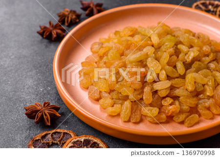 Sweet, dry, golden or yellow raisin made from grapes are a healthy, nutritious food. Golden raisins Sweet, dry, golden or yellow raisin made from grapes are a healthy, nutritious food. Golden raisins 136970998