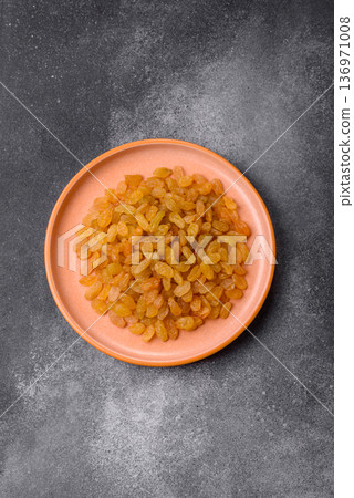 Sweet, dry, golden or yellow raisin made from grapes are a healthy, nutritious food. Golden raisins Sweet, dry, golden or yellow raisin made from grapes are a healthy, nutritious food. Golden raisins 136971008