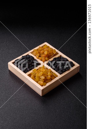 Sweet, dry, golden or yellow raisin made from grapes are a healthy, nutritious food. Golden raisins Sweet, dry, golden or yellow raisin made from grapes are a healthy, nutritious food. Golden raisins 136971015