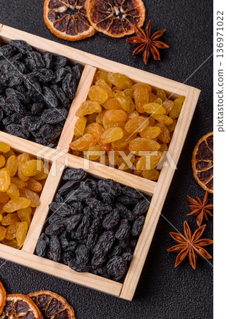 Sweet, dry, golden or yellow raisin made from grapes are a healthy, nutritious food. Golden raisins Sweet, dry, golden or yellow raisin made from grapes are a healthy, nutritious food. Golden raisins 136971022