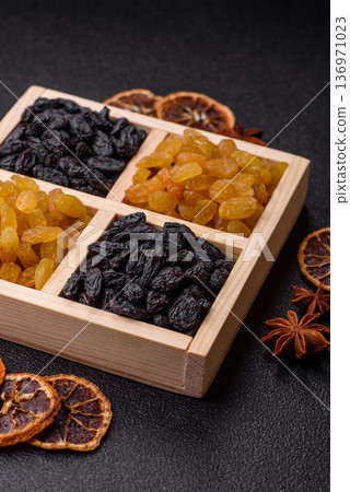 Sweet, dry, golden or yellow raisin made from grapes are a healthy, nutritious food. Golden raisins Sweet, dry, golden or yellow raisin made from grapes are a healthy, nutritious food. Golden raisins 136971023