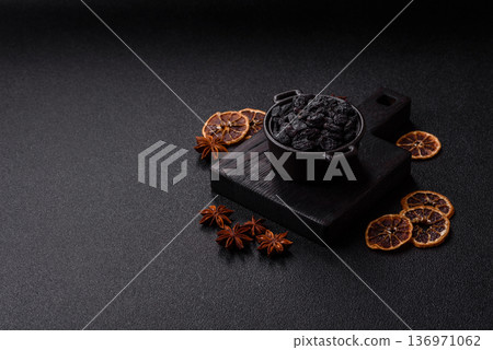 Sweet, dry black or blue raisins made from grapes are a healthy and nutritious food. Black raisins 136971062