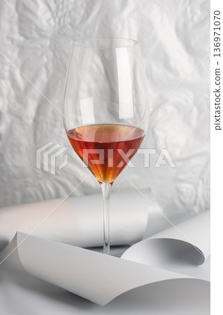 Rose Wine Glass on Minimal White Background. Elegant Modern Beverage Concept Rose Wine Glass on Minimal White Background. Elegant Modern Beverage Concept 136971070