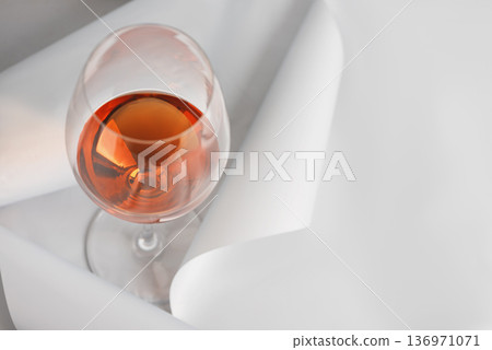 Rose Wine Glass on Minimal White Background. Elegant Modern Beverage Concept Rose Wine Glass on Minimal White Background. Elegant Modern Beverage Concept 136971071