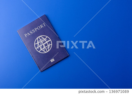 A passport with a foreign visa for flights, travel, and vacations abroad. An international passport A passport with a foreign visa for flights, travel, and vacations abroad. An international passport 136971089
