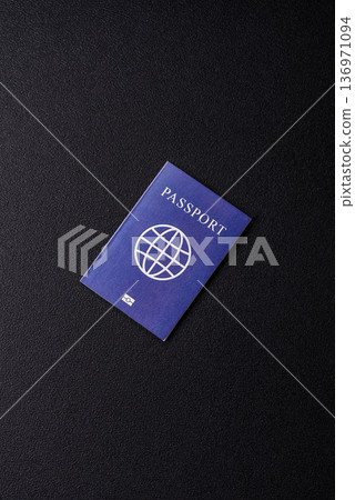 A passport with a foreign visa for flights, travel, and vacations abroad. An international passport A passport with a foreign visa for flights, travel, and vacations abroad. An international passport 136971094